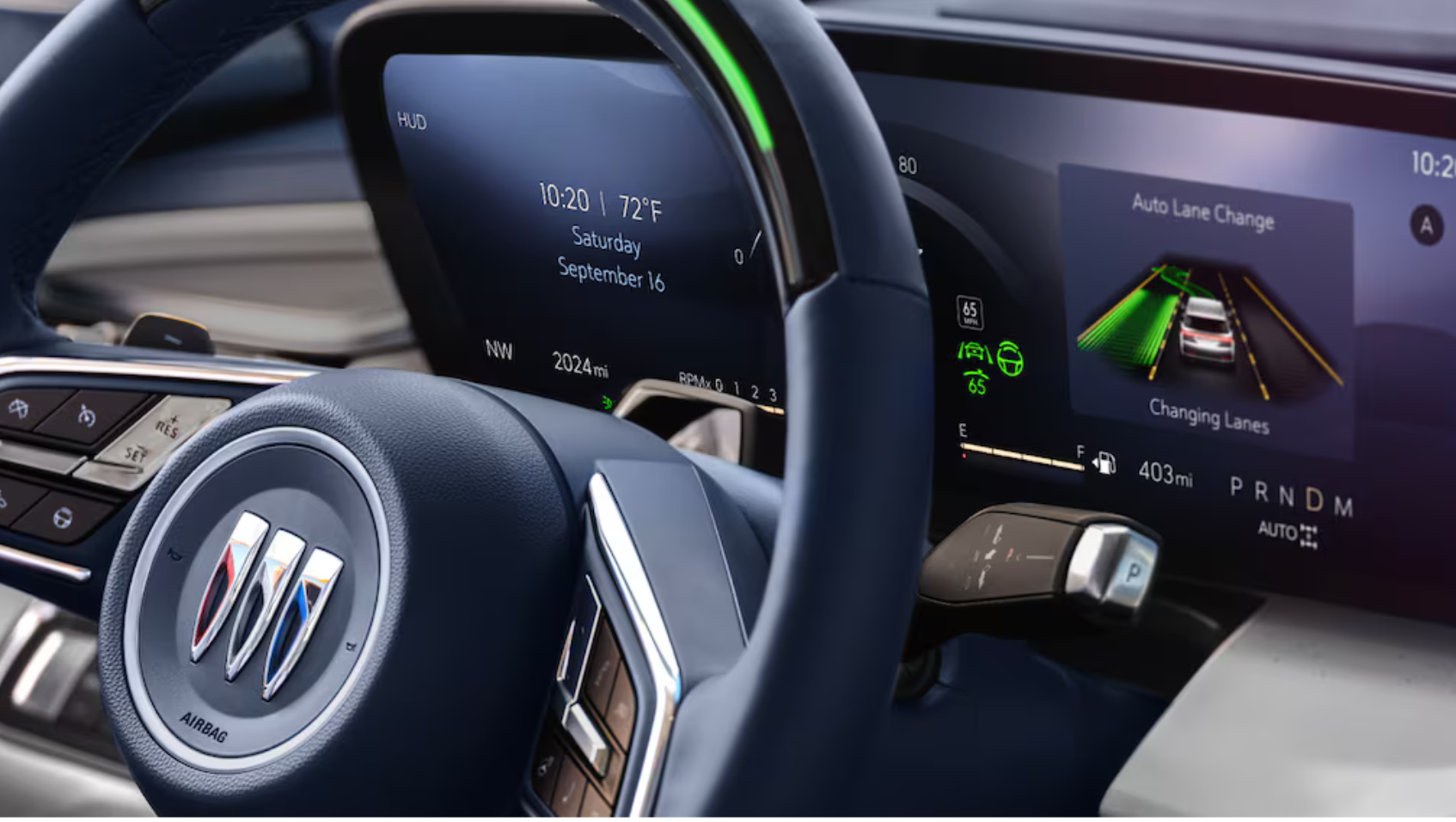 Close-up of the 2025 Buick Enclave's steering wheel and driver display showing Super Cruise lane change in progress