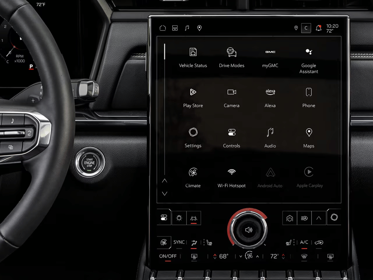 Close-up of the 2025 GMC Terrain infotainment touchscreen and dashboard with controls for drive modes, Alexa, Wi-Fi, and backup camera