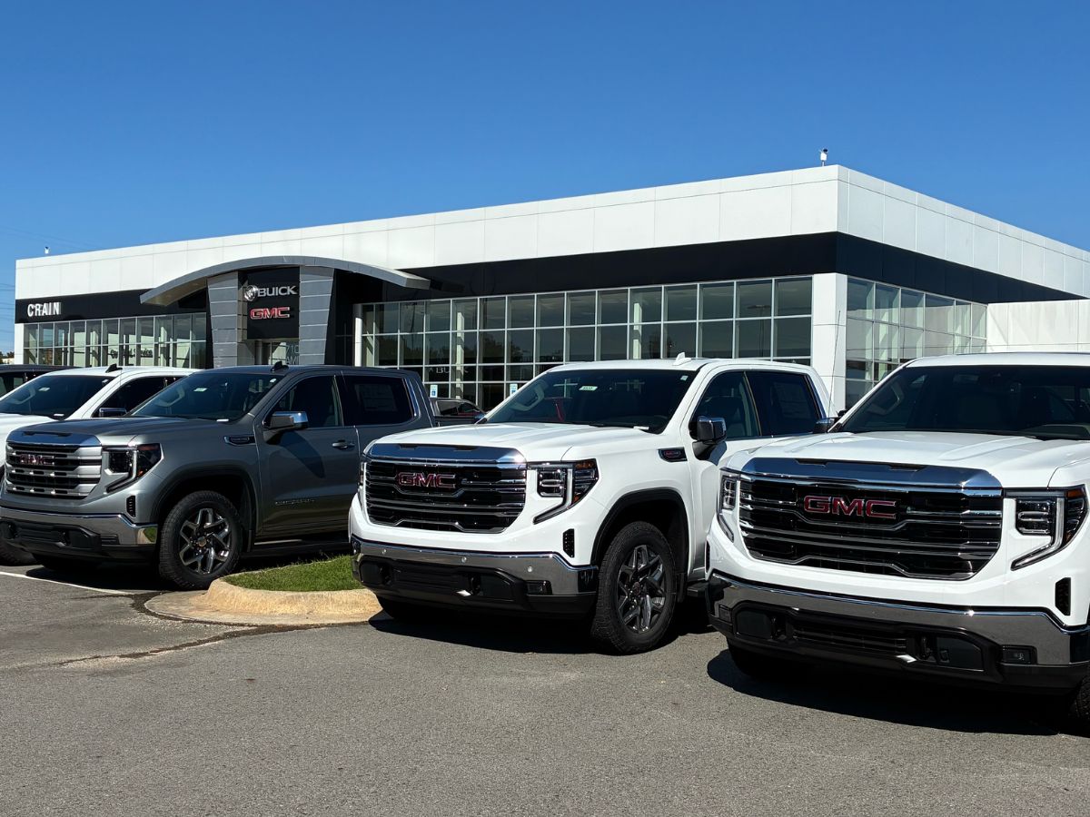 New GMC trucks parked outside Crain Buick GMC dealership in Conway, Arkansas