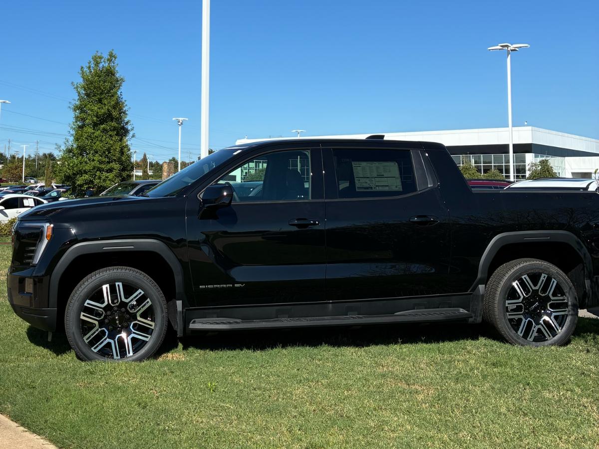 A GMC Sierra EV parked at Crain Buick GMC of Conway, showcasing modern truck capability and bold design for drivers in Central Arkansas.